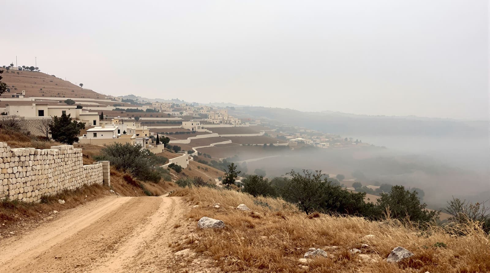 Illustration of terraced hills and stone houses of a southern Lebanon village under an overcast dawn sky