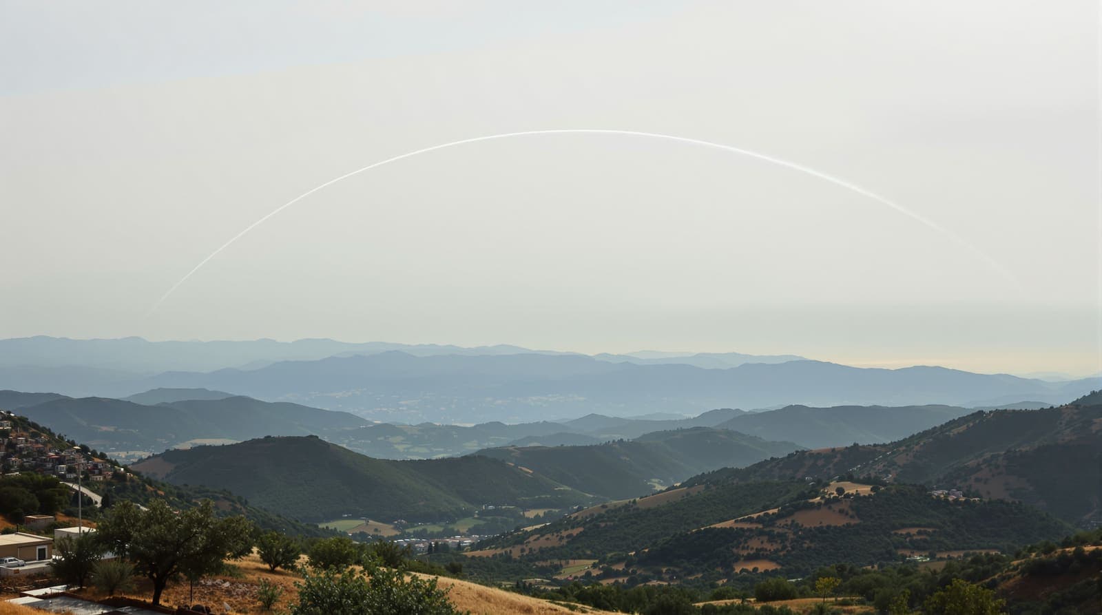Illustration of a white contrail curving above the hazy ridgelines of southern Lebanon, seen from an olive-terraced Galilee hillside at dawn.