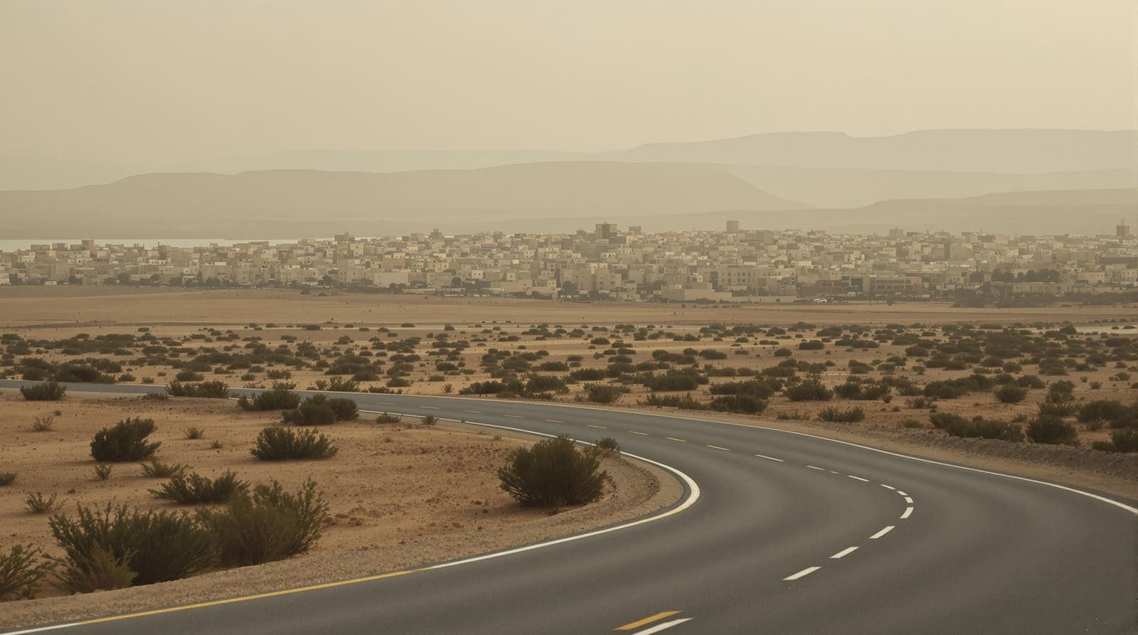 Illustration of a distant hazed skyline of a southern Gaza town at dusk, seen across an empty scrub plain with a quiet sandy road.