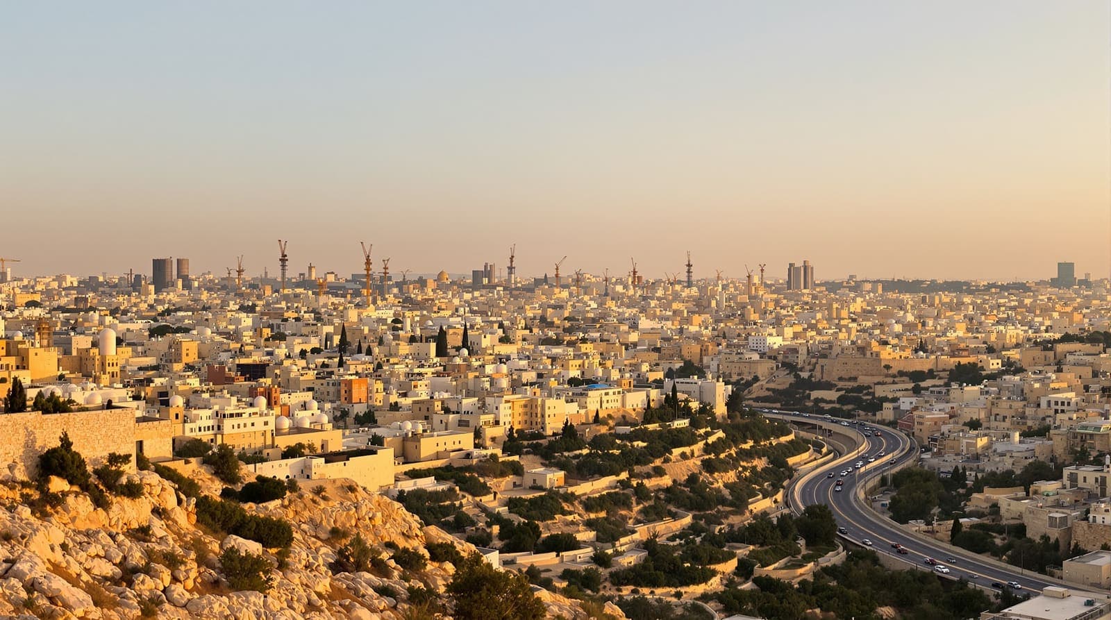 Illustration of Jerusalem's dense limestone skyline at golden hour with a highway leading out of the city.