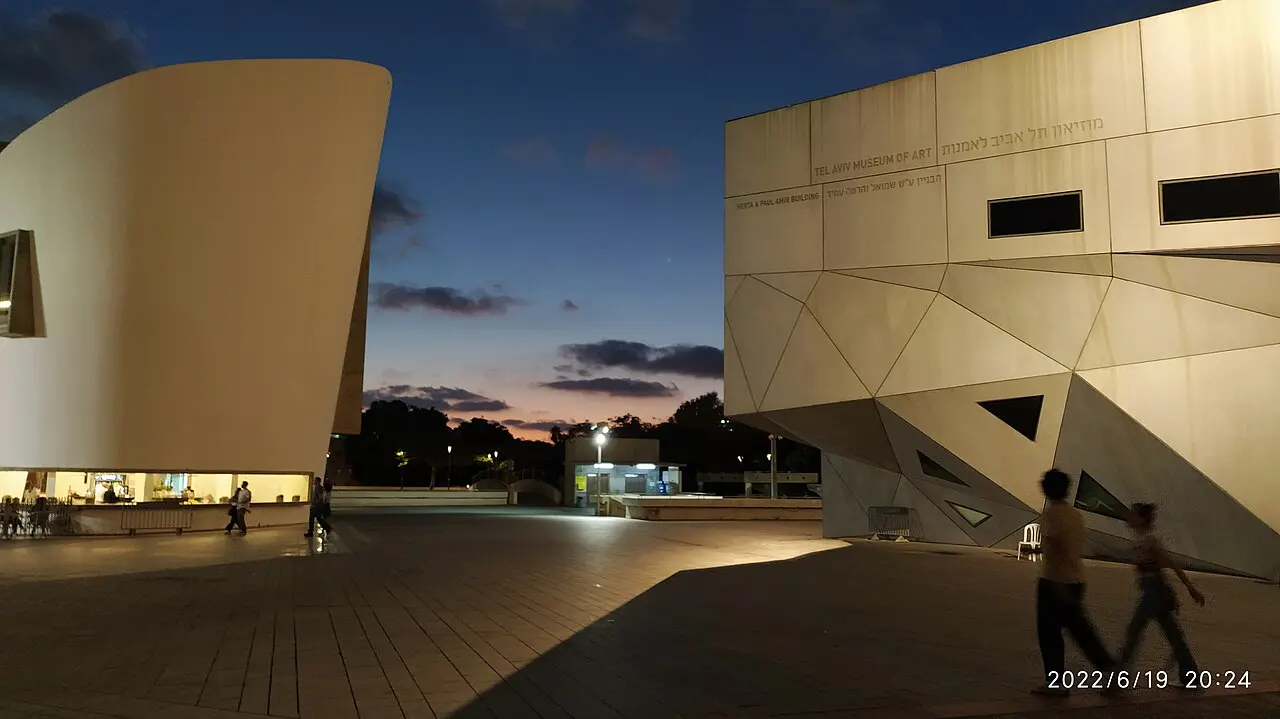 The museum's buildings facing each other across the plaza at dusk